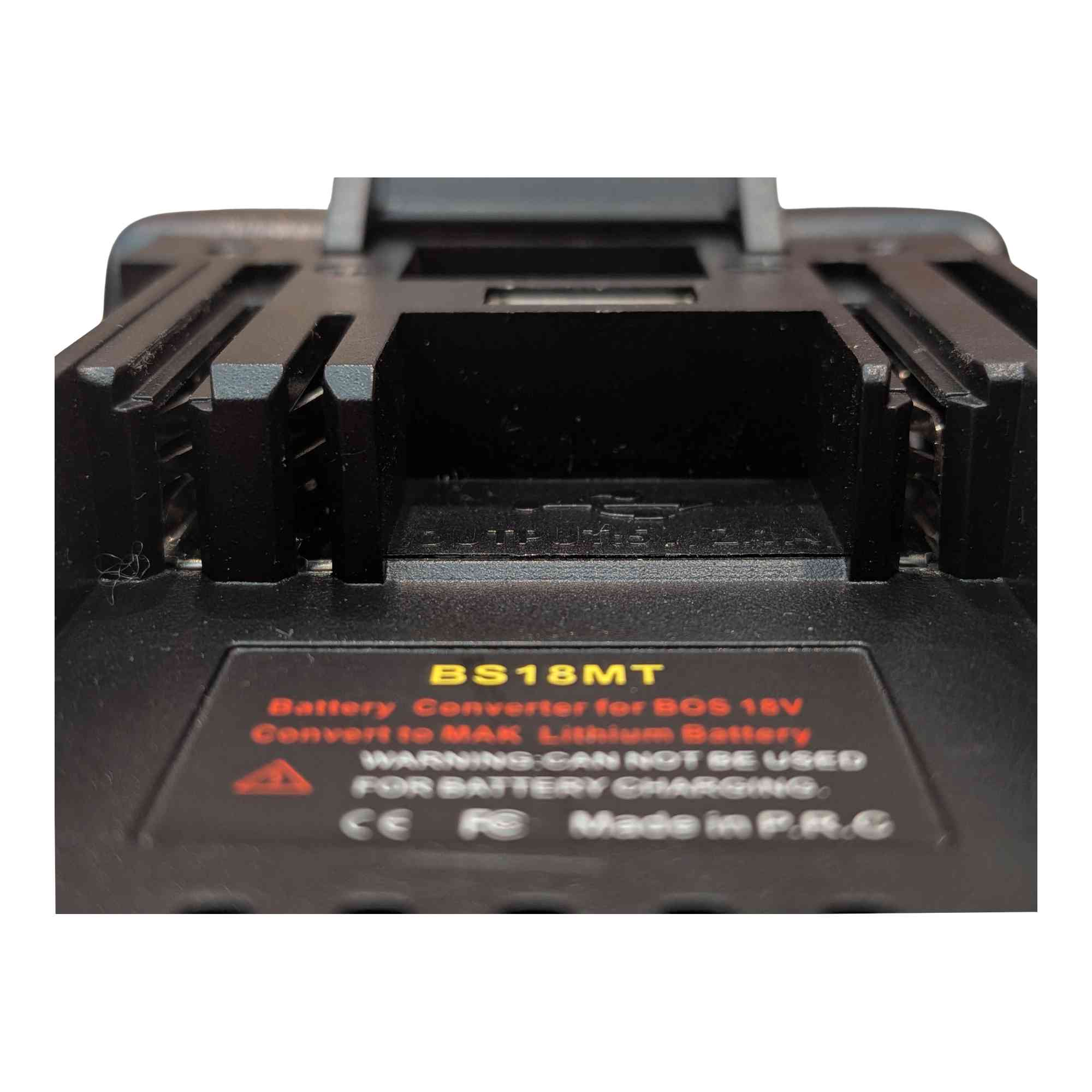 Bosch 18V GBA (Blue) to Makita 18V LXT battery adapter - close-up of the Makita tool-side rail channel, printed label below